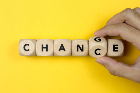 Wooden cube with word change to chance, Personal development and career growth or change yourself concept.の写真素材