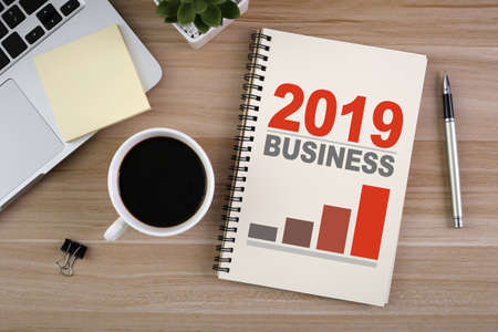 Year 2019 Business Concept on the top view workshop desktop table.の写真素材