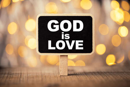 God is Love concept signboard with beautiful background.の写真素材