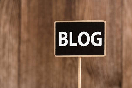 Blog Word Letters Sign against old wooden background.の写真素材