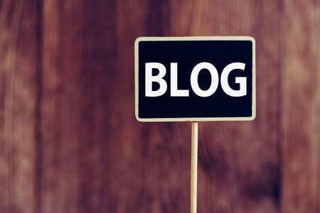 Blog Word Letters Sign against old wooden background.の写真素材