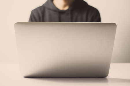 Hacker in front of the laptop computer.の写真素材