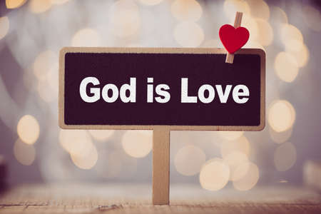 God is Love concept signboard with beautiful background.の写真素材