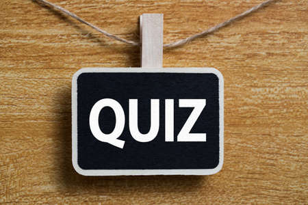 Quit Word Letters Sign against old wooden background.の写真素材