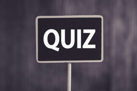 Quit Word Letters Sign against old wooden background.の写真素材