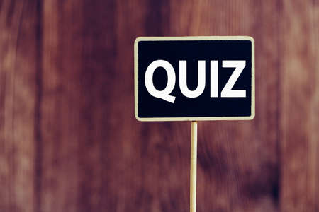 Quit Word Letters Sign against old wooden background.の写真素材