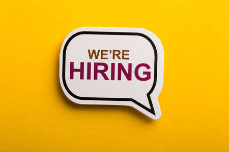 We Are Hiring speech bubble isolated on yellow background.の写真素材