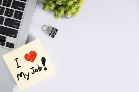 I Love My Job concept on office desk table with laptop and supplies. Top view with copy space.の写真素材