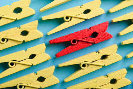 Stand out from the crowd and different concept. Leadership and other similar concepts. One red...