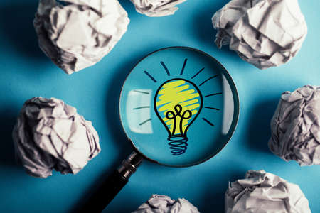 Creative Idea And Innovation Concept with magnifying on blue background.の写真素材