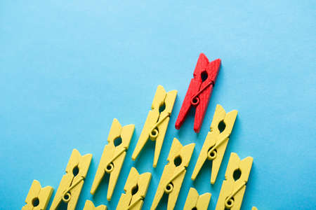 Stand out from the crowd and different concept. Leadership and other similar concepts. One red...