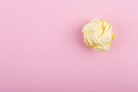 Crumpled paper balls isolated on pink background.の写真素材