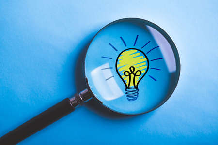 Creative Idea And Innovation Concept with magnifying on blue background.の写真素材
