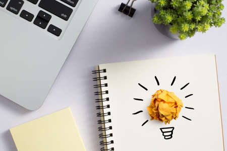 Concept creative idea and innovation with paper ball on desktop topview.