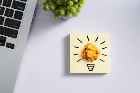 Concept creative idea and innovation with paper ball on desktop topview.