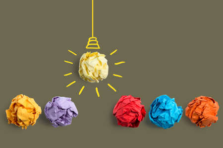 Inspiration concept crumpled paper light bulb metaphor for good idea.