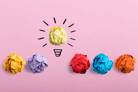 Inspiration concept crumpled paper light bulb metaphor for good idea.