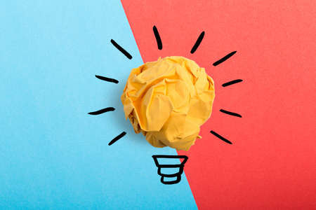 Inspiration concept crumpled paper light bulb metaphor for good idea.の写真素材
