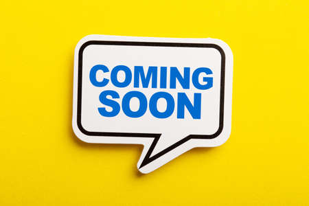Coming Soon speech bubble isolated on the yellow background.の写真素材