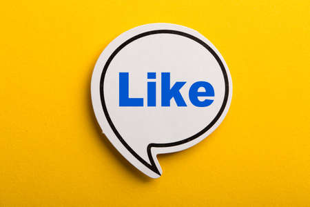 Like speech bubble isolated on the yellow background.の写真素材