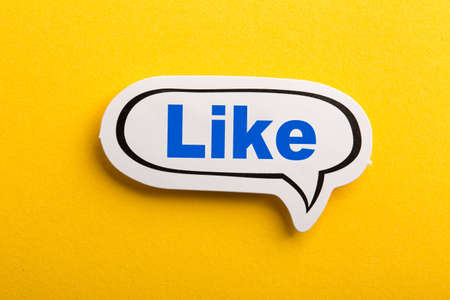 Like speech bubble isolated on the yellow background.の写真素材
