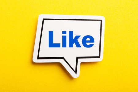 Like speech bubble isolated on the yellow background.の写真素材