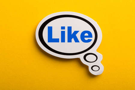 Like speech bubble isolated on the yellow background.の写真素材