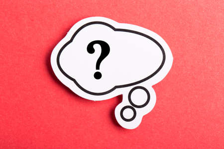 Question mark speech bubble isolated on red background.の写真素材