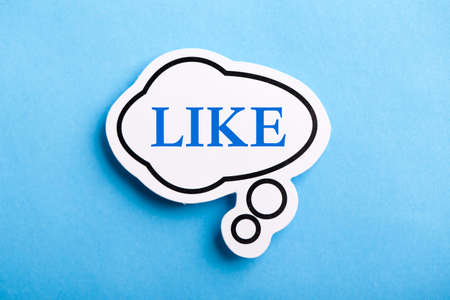 Like text speech bubble isolated on blue background.の写真素材