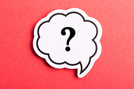 Question mark speech bubble isolated on red background.の写真素材