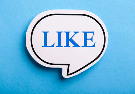 Like text speech bubble isolated on blue background.の写真素材