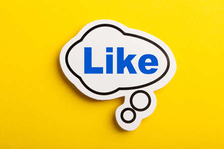 Like speech bubble isolated on the yellow background.の写真素材