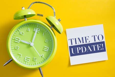 Time to update concept with alarm clock aside.の写真素材