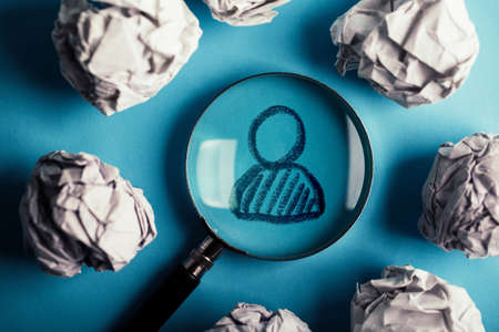 Concept of search for worker with magnifying glass.の写真素材