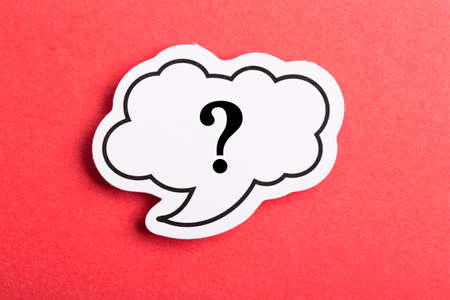 Question mark speech bubble isolated on red background.の写真素材