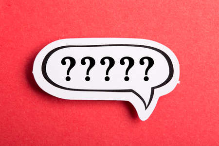 Question mark speech bubble isolated on red background.の写真素材