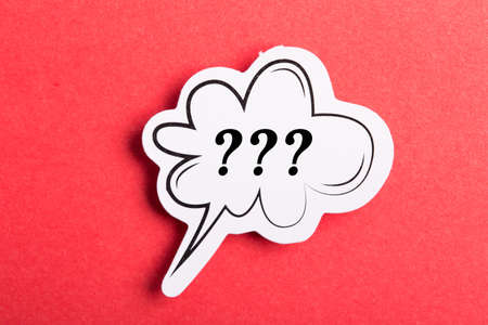 Question mark speech bubble isolated on red background.の写真素材