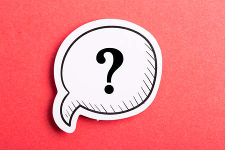 Question mark speech bubble isolated on red background.の写真素材