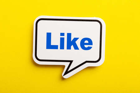 Like speech bubble isolated on the yellow background.の写真素材