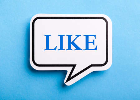 Like text speech bubble isolated on blue background.の写真素材