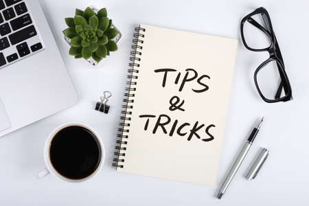 Tips And Tricks concept on desktop workspace with office supplies.の写真素材
