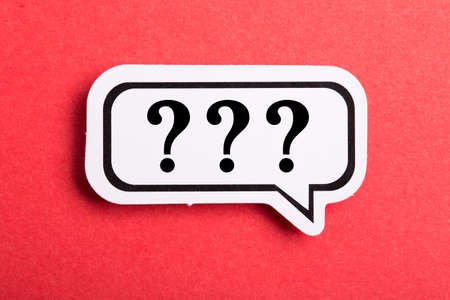Question mark speech bubble isolated on red background.の写真素材