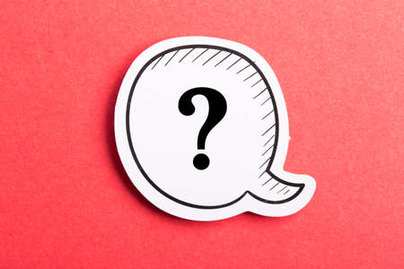 Question mark speech bubble isolated on red background.の写真素材