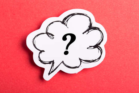 Question mark speech bubble isolated on red background.の写真素材