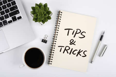 Tips And Tricks concept on desktop workspace with office supplies.の写真素材