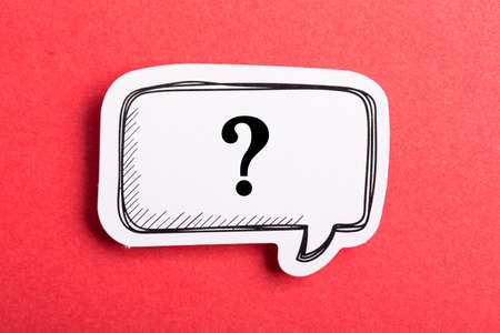 Question mark speech bubble isolated on red background.の写真素材