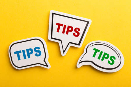 Tips speech bubble isolated on the yellow background.の写真素材