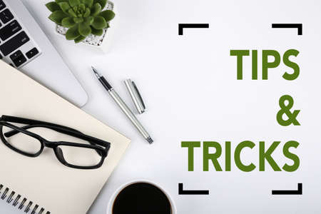 Tips And Tricks concept on desktop workspace with office supplies.の写真素材