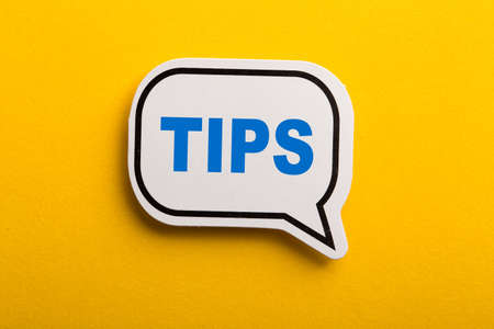 Tips speech bubble isolated on the yellow background.の写真素材