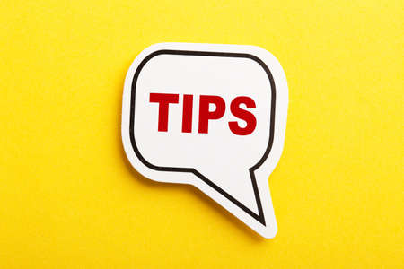 Tips speech bubble isolated on the yellow background.の写真素材